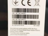 the back of a cell phone with a bar code on it