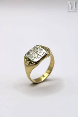 a close up of a gold ring with a diamond on it