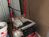 an image of a small air compressor in a garage