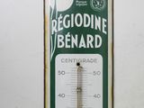 a thermometer hanging on a wall in a room
