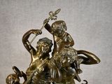 a bronze statue of a man and a woman on a horse
