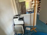 an image of a room with a blue floor and a white radiator