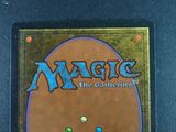 the back of a card with the words magic the gathering on it