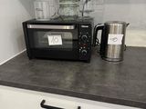 a microwave and a blender on a counter in a kitchen