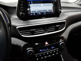 a car dashboard with a radio and a steering wheel