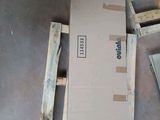 a cardboard box sitting on top of a pallet on the floor