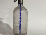 an old fashioned glass bottle with a blue line painted on it