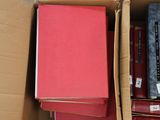 a box full of books that are sitting on the floor