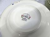 a white plate with a design on it sitting on a table
