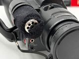 a camera with a microphone attached to it ' s body