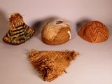 three hats and a hat on a table with a white background