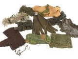 many different types of gloves and gloves laid out on the ground
