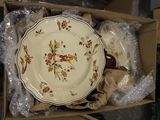 a box with a plate in it that is sitting on a table