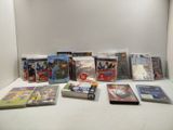 a lot of dvd ' s and games on the table