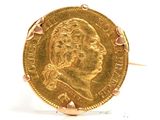 an image of a close up of a gold coin on a white surface