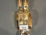 an image of a gold wrist watch with a price tag on it
