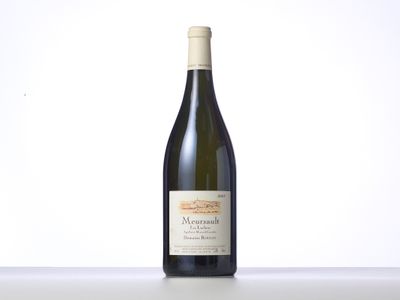 a bottle of wine sitting on top of a table
