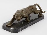statue of a lion on a marble base