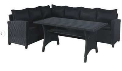 a black patio furniture set with a table and chairs