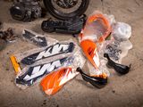 many different types of motorbikes that are sitting on the ground