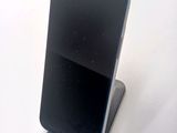 a cell phone that is sitting on top of a stand