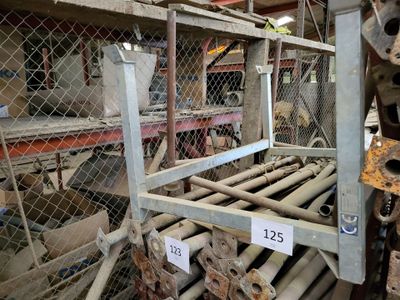 a metal rack with a number of pipes on it