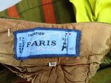 a label on the back of a jacket that says paris