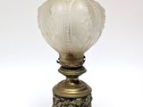 a lamp that is sitting on a table next to a lamp