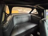 the interior of a car with a black leather seat and black leather seats