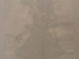 a drawing of a woman in a dress on a piece of paper