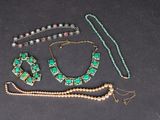 several pieces of jewelry including a necklace, bracelet, and bracelet