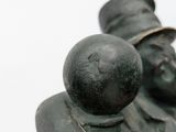 a statue of a man and a woman sitting next to each other