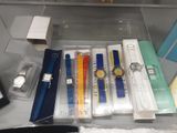 a lot of watches and other items in the case