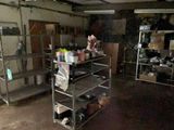 a room that has a bunch of shelves in it