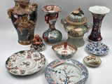 many different types of vases and plates on the table