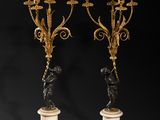 a pair of antique brass and marble candelabs