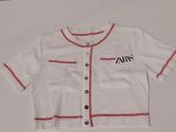 an image of a white shirt with red trims