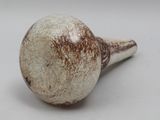 a close up of a white and brown object on a white surface