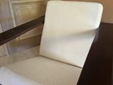 a chair that is sitting in the corner of a room