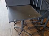 a lot of chairs and a table in a room