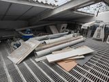 a lot of junk on the floor of a building