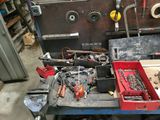 a workbench with tools on it in a garage