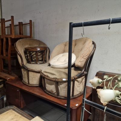many chairs and tables in a room with a lot of furniture
