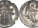 a close up of a silver coin with an image of a woman on it