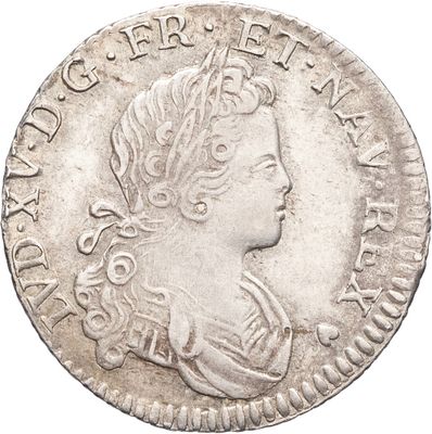 une pièce d'argent portant une tête de femme et une couronne
