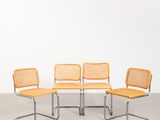 un lot de quatre chaises orange de style Miesler