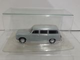 a small toy car in a glass case on a table