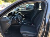 the interior of a car with black seats and a black steering wheel