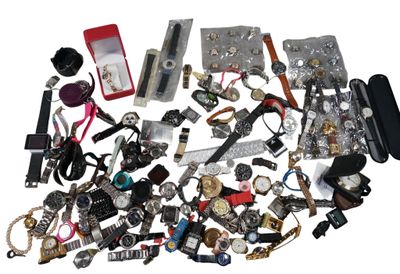 a pile of assorted watches and other items