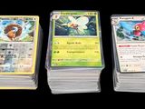 four different types of pokemon cards sitting on top of each other
